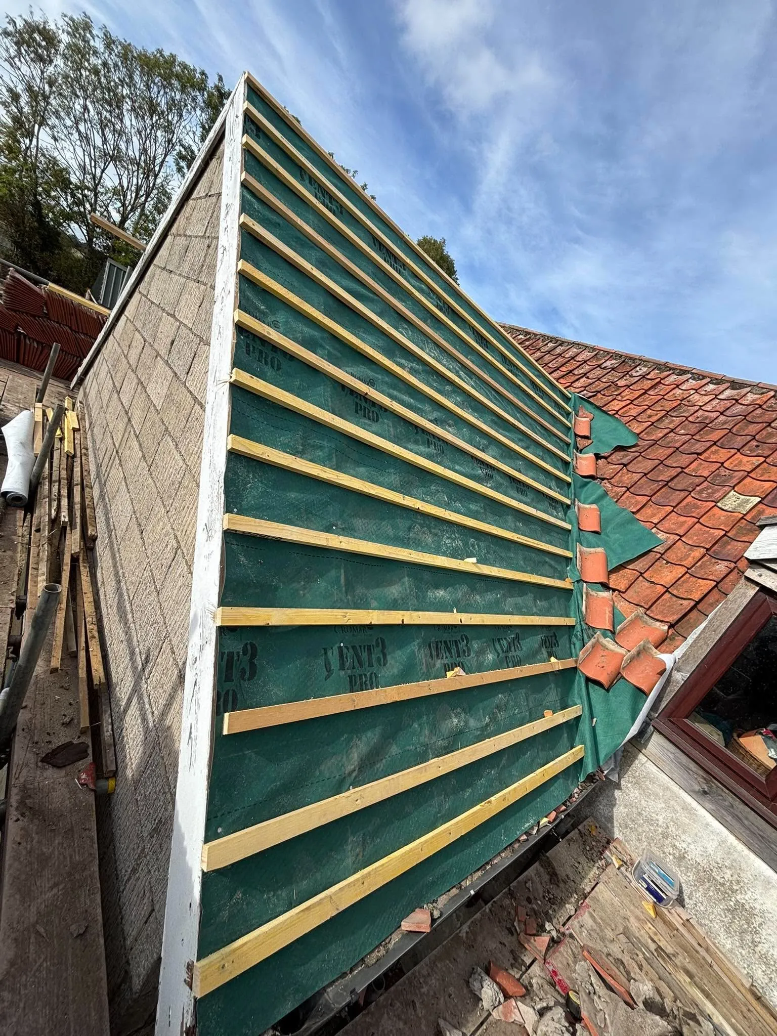 New breathable membrane and battens on a roof renewal